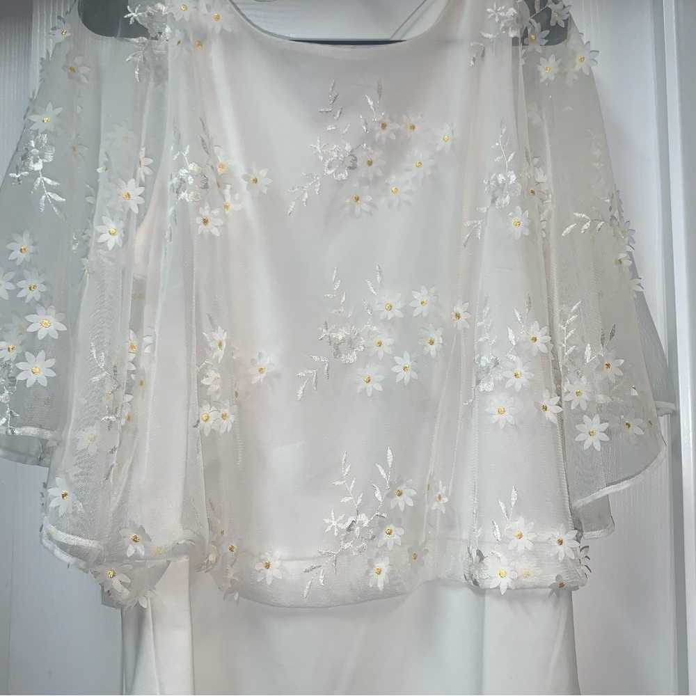 Prelude lovely, cool versatile top. Perfect for this summer. Nicely embellished